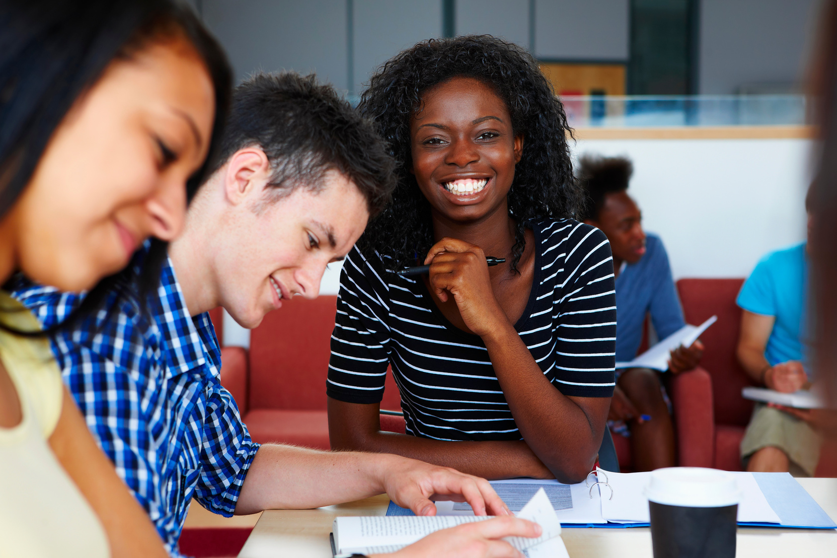 happy black female student studying in classroom